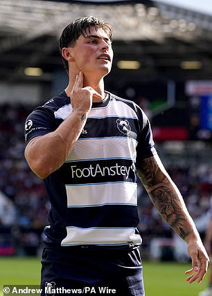 Rees-Zammit celebrates a try against Northampton with a 'pulse check' celebration