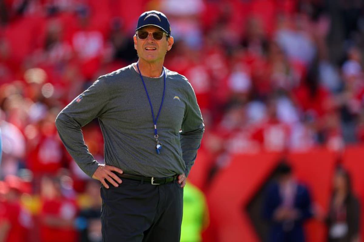 Head coach Jim Harbaugh of the Los Angeles Chargers watches pregame warmups prior to the game against the Kansas City Chiefs at Arrowhead Stadium on October 18, 2026 in Kansas City, Missouri.