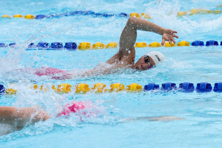 Taishu Sato competing in modern pentathlon's swimming portion of the sport.