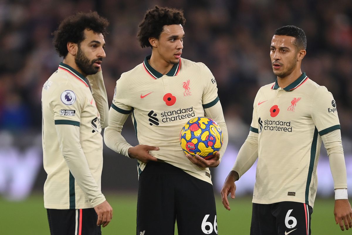 Mohamed Salah, Trent Alexander-Arnold and Thiago Alcantara of Liverpool weigh up their options at a free-kick during the Premier League match between West Ham United  and  Liverpool at London Stadium