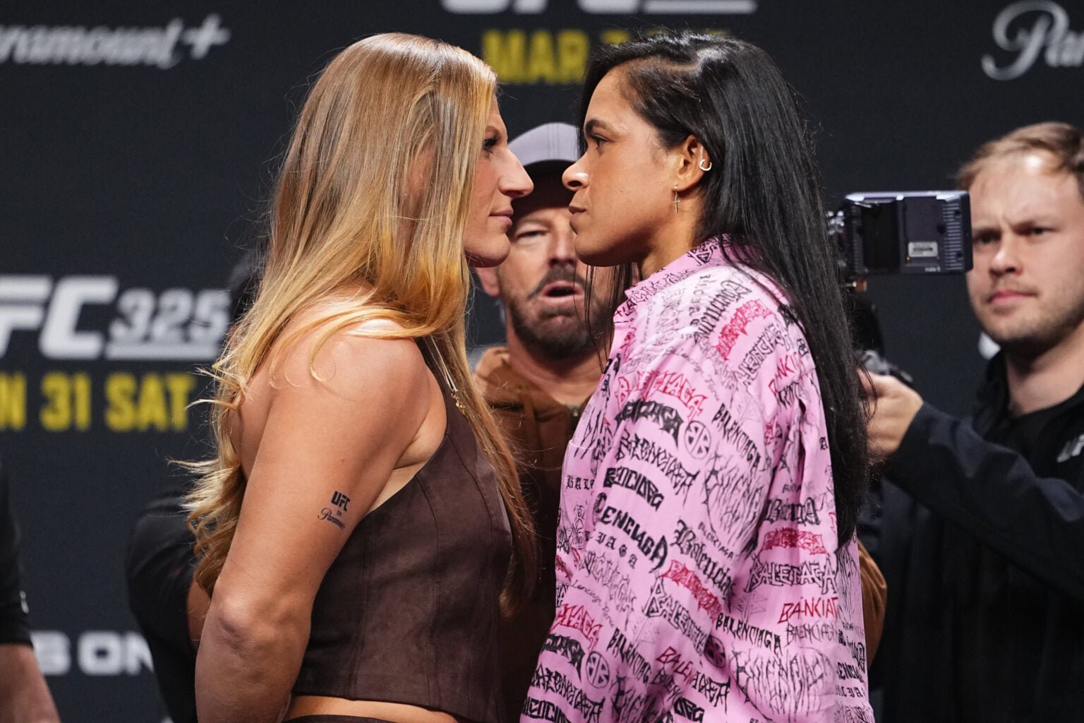Kayla Harrison and Amanda Nunes facing off before their UFC 324 title fight