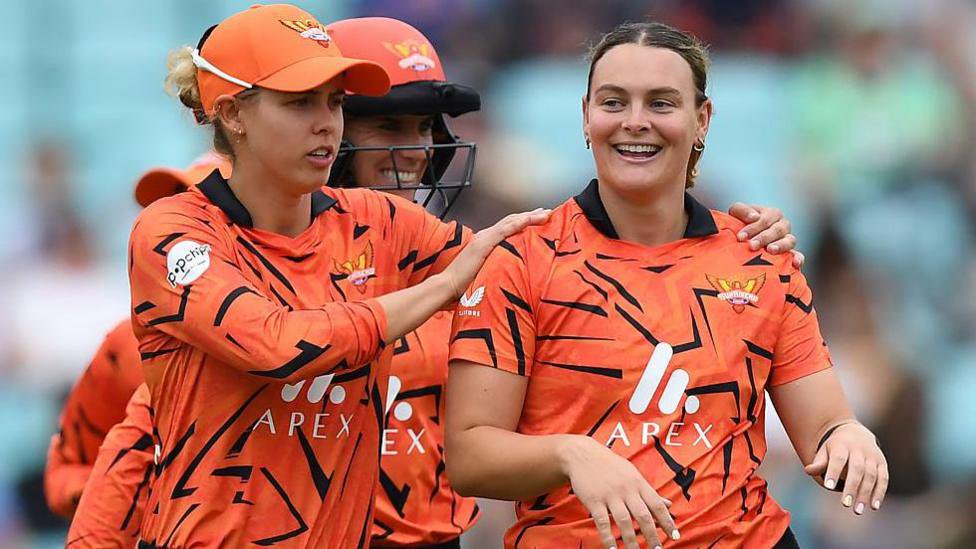 Phoebe Litchfield and Dani Gibson celebrate a wicket for Sunrisers Leeds