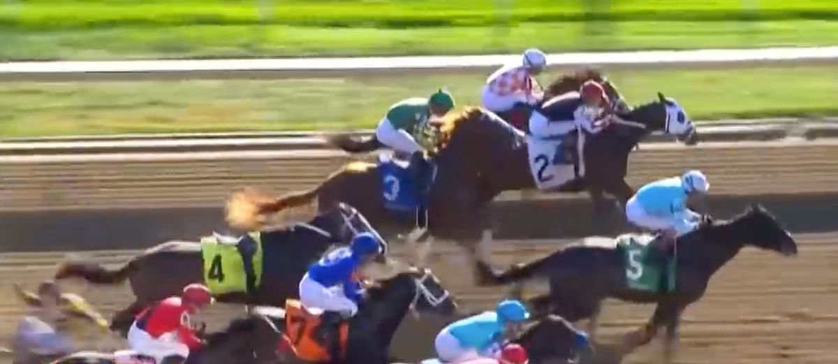 Irad Ortiz (eft) falls to the ground from horse 4 at Keeneland