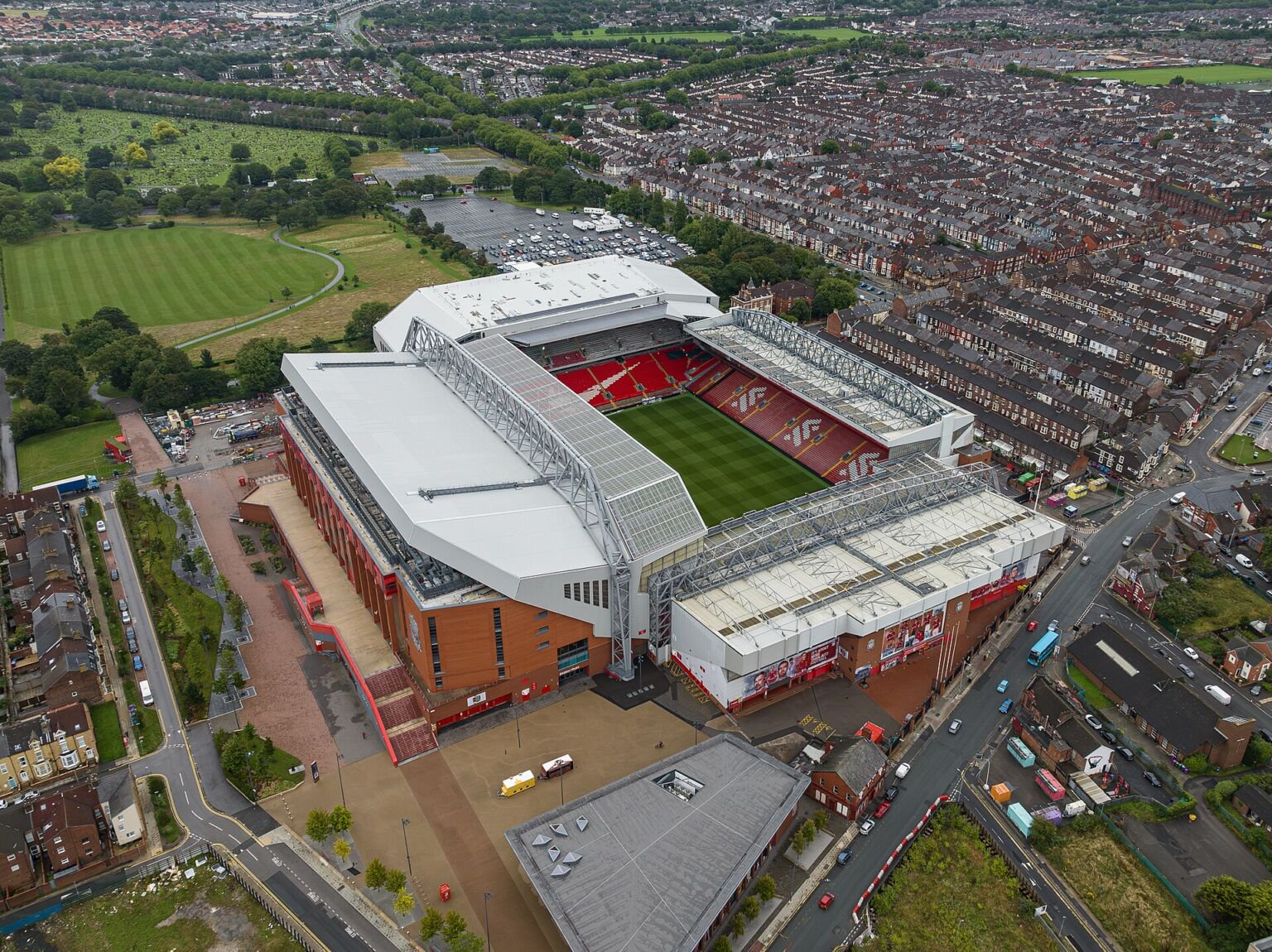 Aerial view of Anfield stadium with red seats, surrounded by Liverpool terraced streets