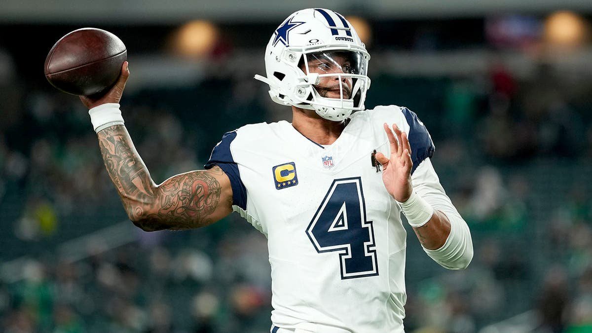 Dak Prescott warms up before an NFL game against the Philadelphia Eagles in Philadelphia.