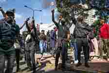 Protesters chant slogans during the demonstration. Kenyan law enforcement fired teargas and live ammunition into the largely peaceful crowd, with unconfirmed reports of several dead on social media. Protesters called for members of Kenya's Parliament to reject the proposed legislation, which would increase taxes across the country's economy. Katie G. Nelson/SOPA Images via ZUMA Press Wire/dpa