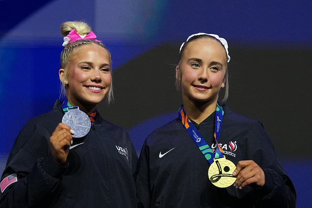 Silver medalist Reese Esponda, left, and gold medalist Claire Pease, both of the United States, pose on the podium of the floor exercise during the apparatus finals at the Artistic Gymnastics World Championships in Rotterdam, the Netherlands, Sunday, Oct. 25, 2026. (AP Photo/Patrick Post)