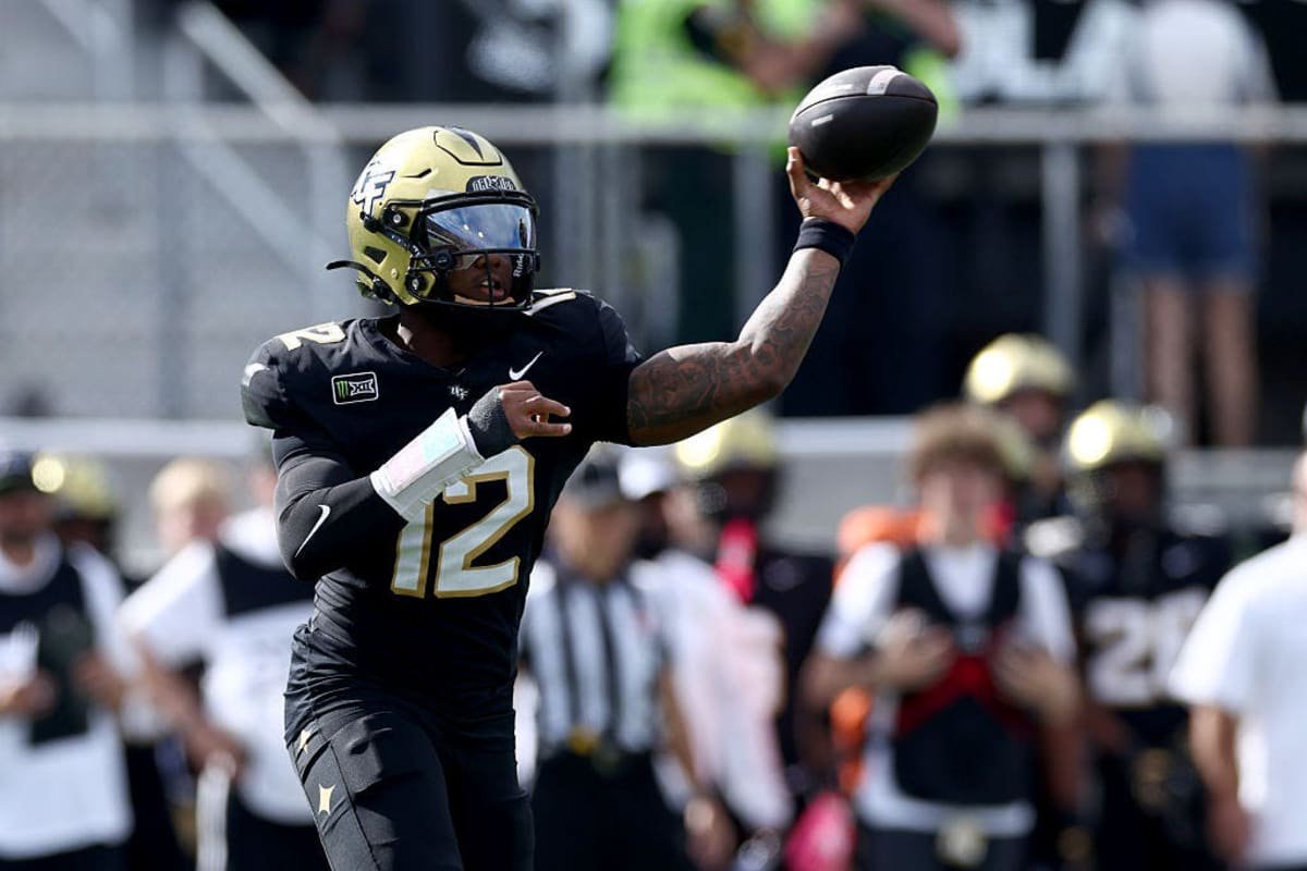 ORLANDO, FLORIDA - OCTOBER 24:Keyone Jenkins #12 of the UCF Knights  passes the ball in the first quarter of the game between the UCF Knights and BYU Cougars at Acrisure Bounce House on October 24, 2026 in Orlando, Florida. (Photo by Dustin Markland/Getty Images)