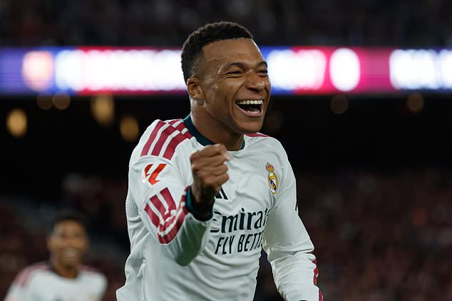 Real Madrid's Kylian Mbappe celebrates after scoring his side's opening goal during a Spanish La Liga soccer match between FC Barcelona and Real Madrid in Barcelona, Spain, Sunday, Oct. 25, 2026. (AP Photo/Joan Monfort)