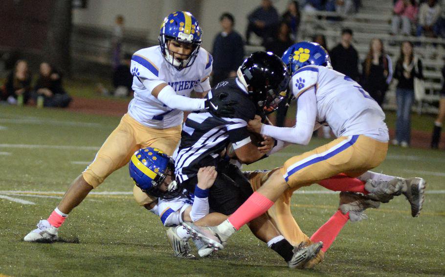 Gabriel Simpkins gets gang tackled.