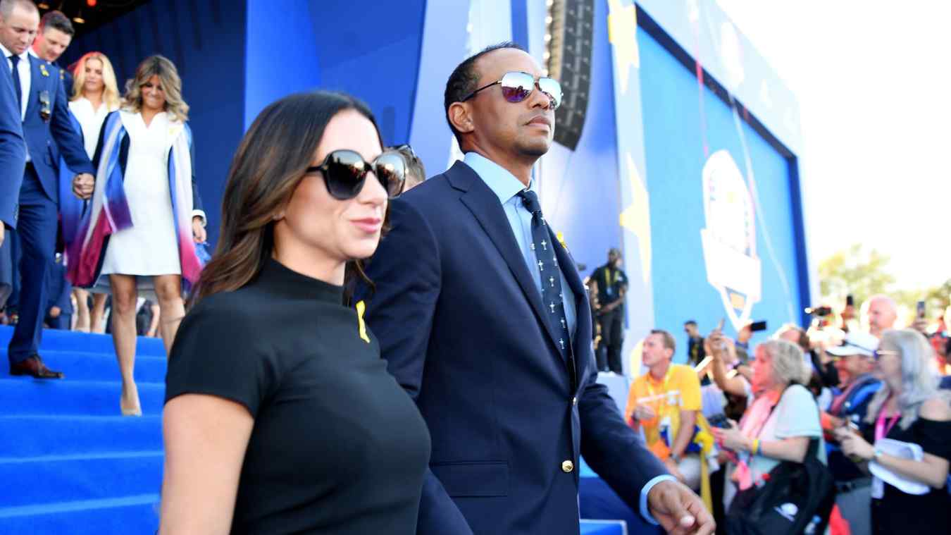 Tiger Woods of the United States and girlfriend Erica Herman depart the opening ceremony for the 2018 Ryder Cup at Le Golf National on September 27, 2018
