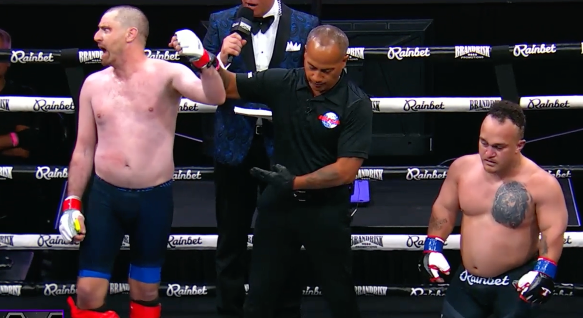 Bob Menery has his hand raised after beating Big Zo