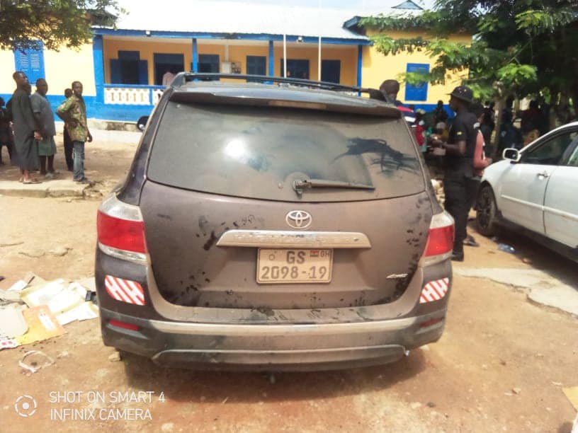 May be an image of car and road