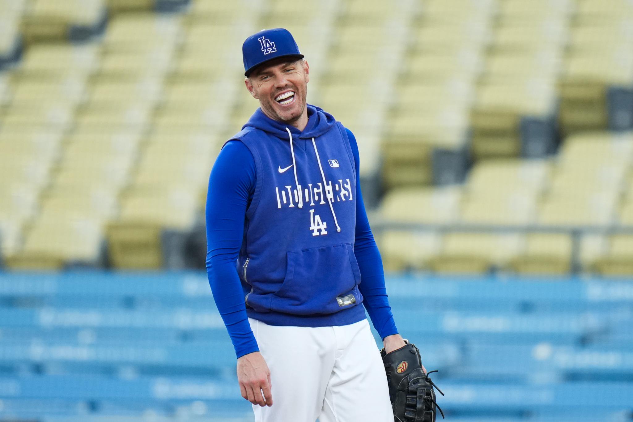 Los Angeles Dodgers' Freddie Freeman smiles during a workout.