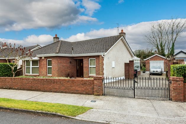 Newbridge bungalow close to main street features gated entrance, 160sq ft garage and four bedrooms