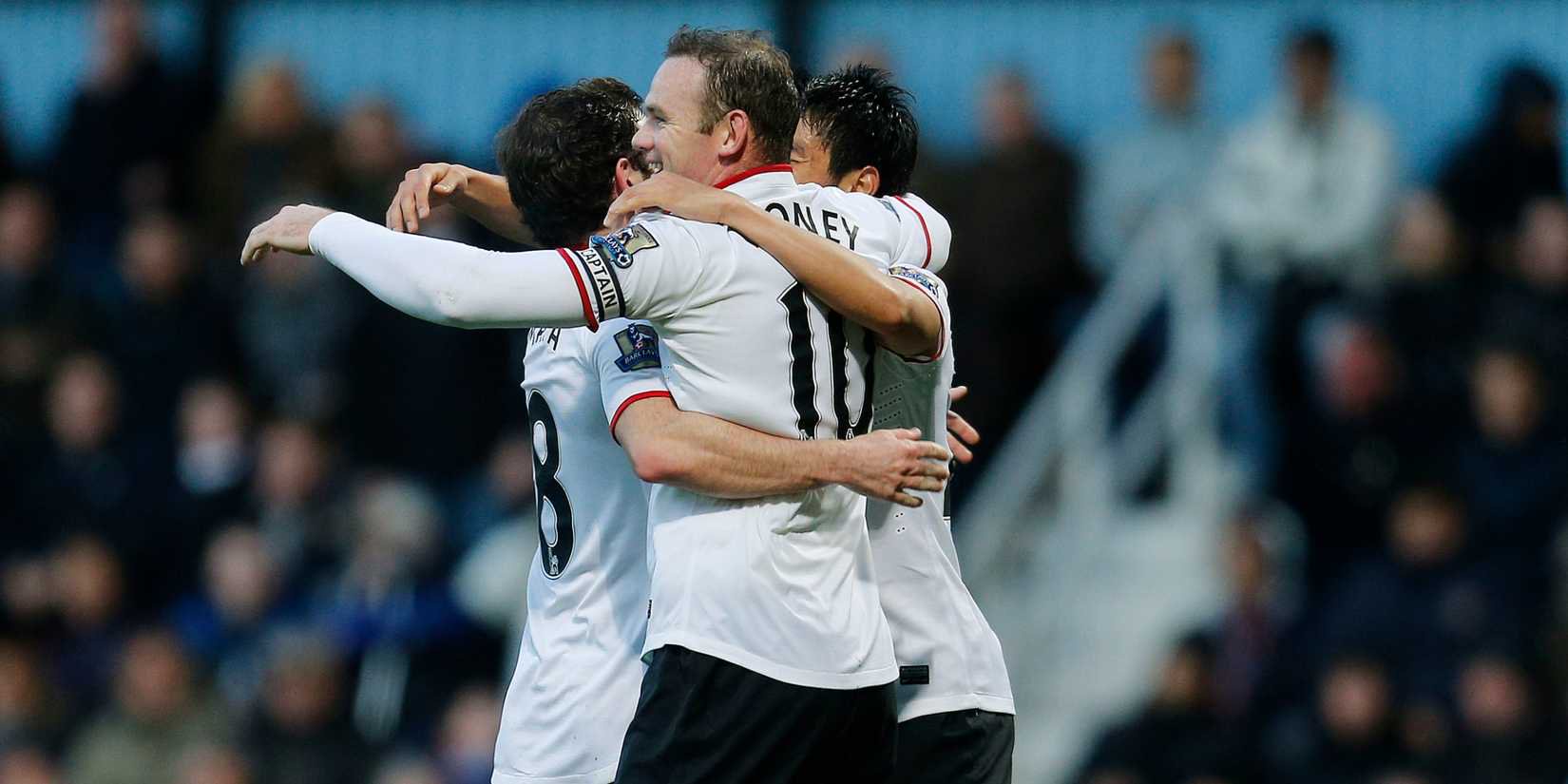 Wayne Rooney celebrates halfway-line goal for Manchester United