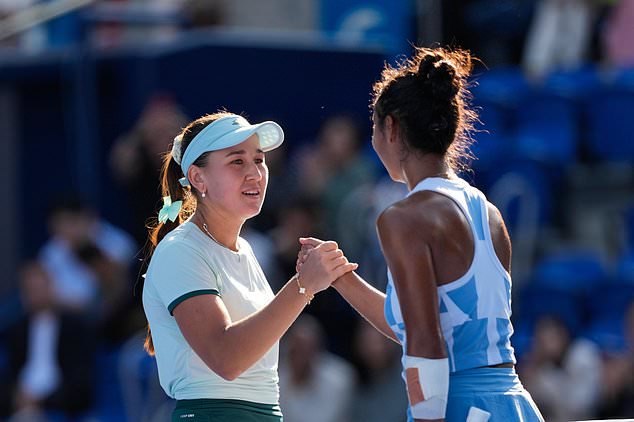 Kamilla Rakhimova of Uzbekistan congratulates Leylah Fernandez of Canada after their singles semifinal match at the Pan Pacific Open tennis tournament Saturday, Oct. 31, 2026, in Tokyo. (AP Photo/Eugene Hoshiko)