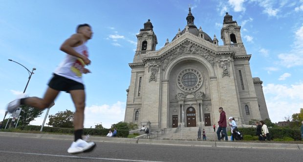 A runner passes by the Cathedral of St. Paul.