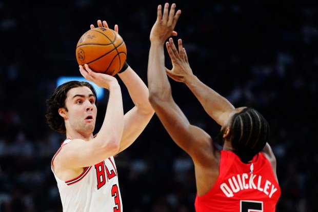 Chicago Bulls' Josh Giddey shoots over Toronto Raptors' Immanuel Quickley during the first half of a game in Toronto, Wednesday, Oct. 21, 2026. (Frank Gunn/The Canadian Press via AP)