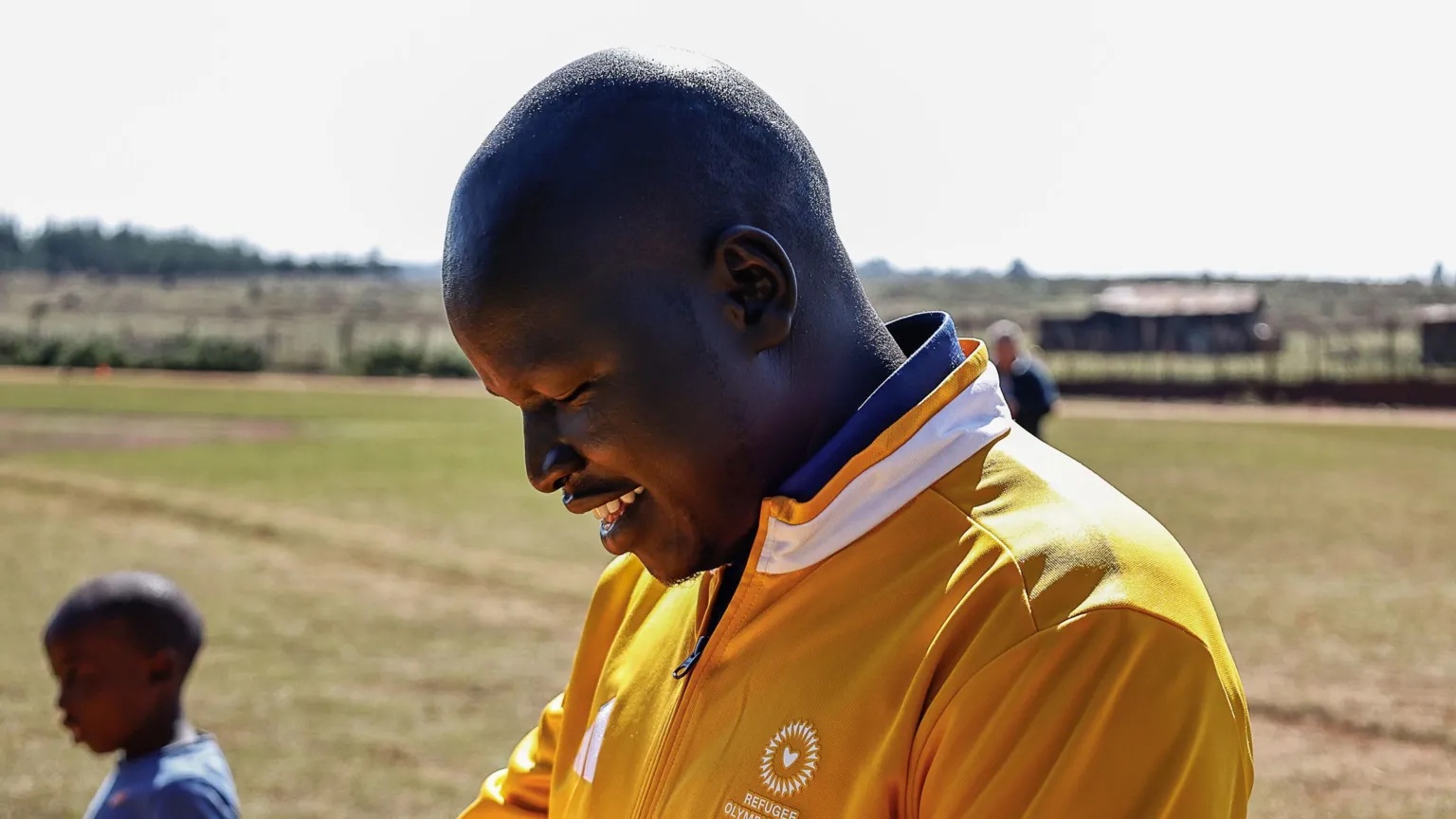 Getty Images Yiech Pur Biel, Chef de Mission, smiles during the training camp of the IOC Refugee Olympic Team for the Dakar 2026 Youth Olympic Games on September 9, 2026 in Kaptagat, Kenya