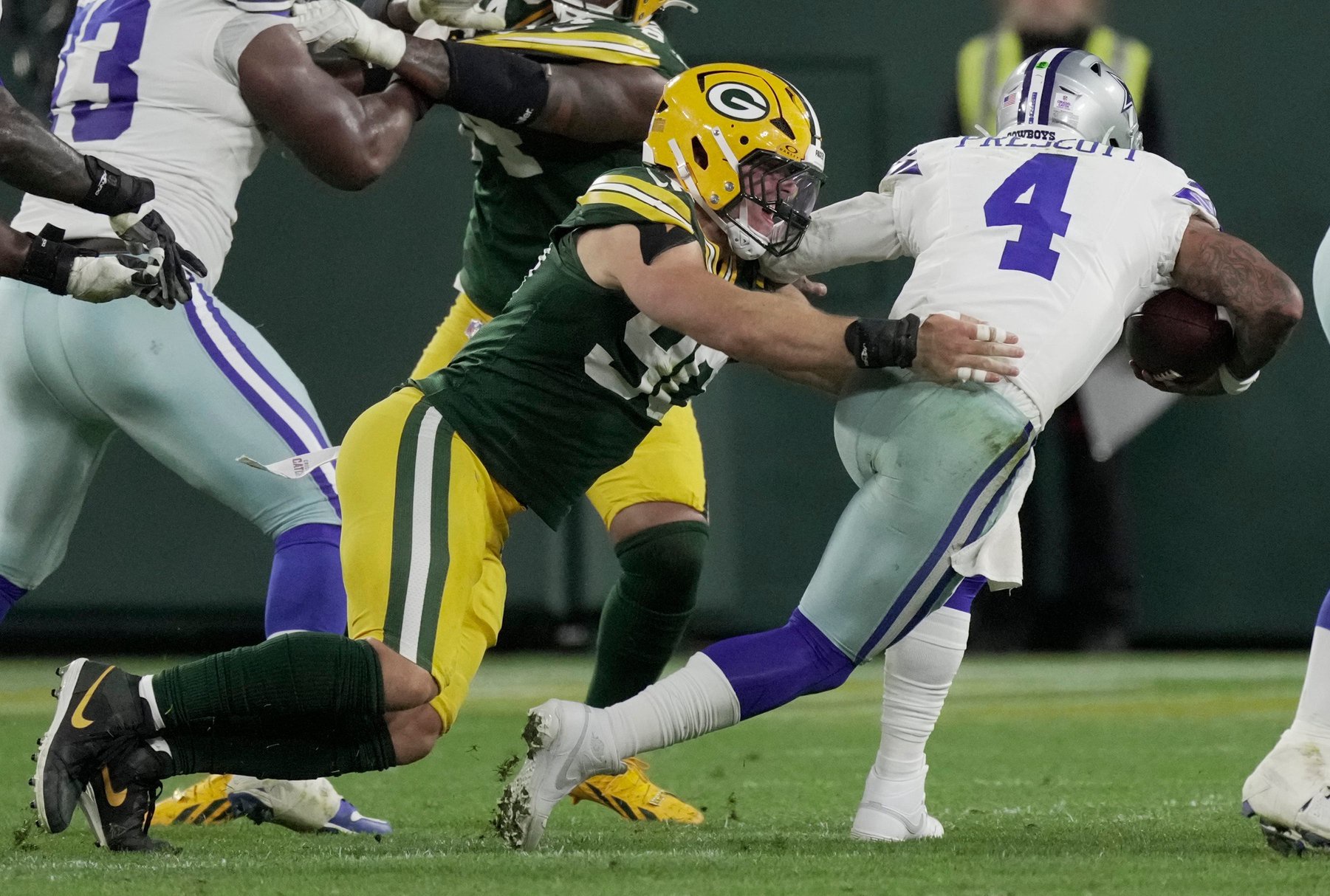 Green Bay Packers defensive end Lukas van Ness (90) sacks Dallas Cowboys quarterback Dak Prescott (4) during the fourth quarter of their game Sunday, Oct. 18, 2026 at Lambeau Field in Green Bay, Wisconsin.