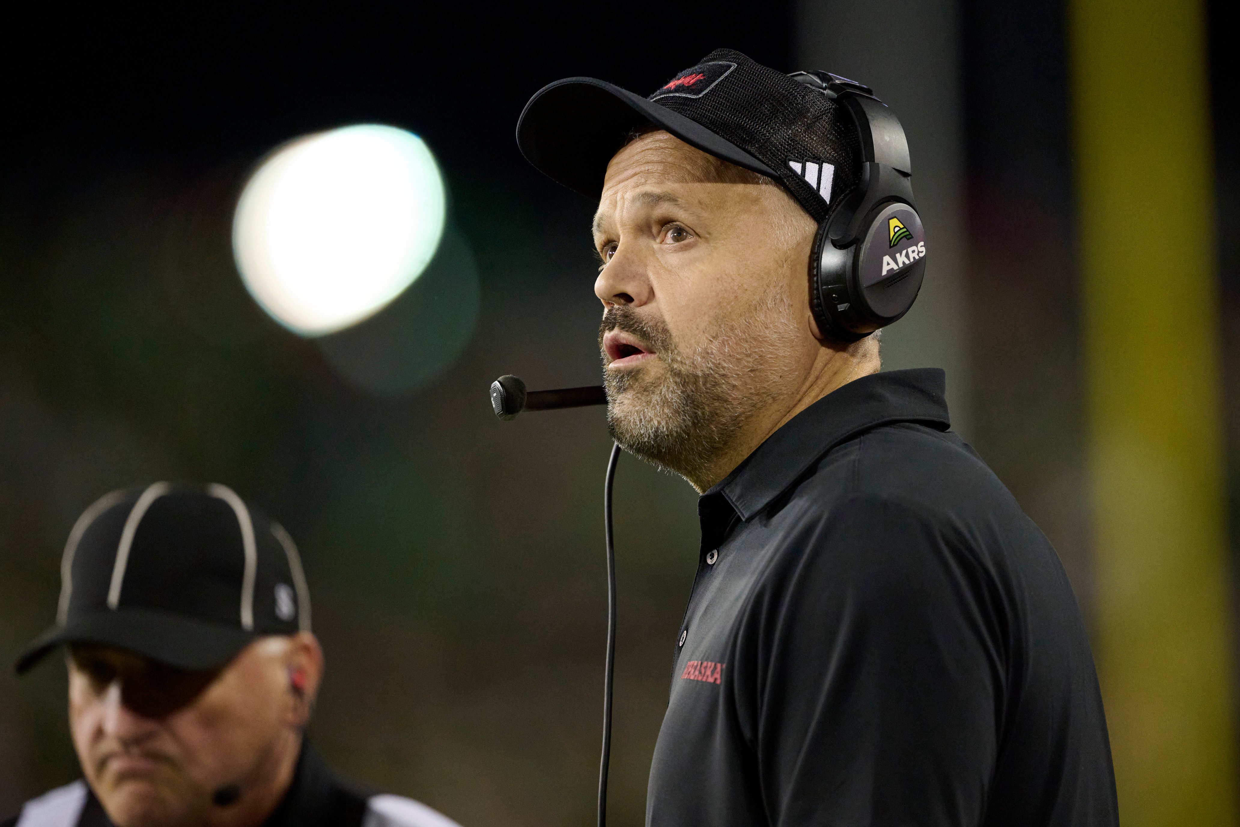 Oct 17, 2026; Eugene, Oregon, USA; Nebraska Cornhuskers head coach Matt Rhule watches a replay during the first half in a game against the Oregon Ducks at Autzen Stadium. Mandatory Credit: Troy Wayrynen-Imagn Images