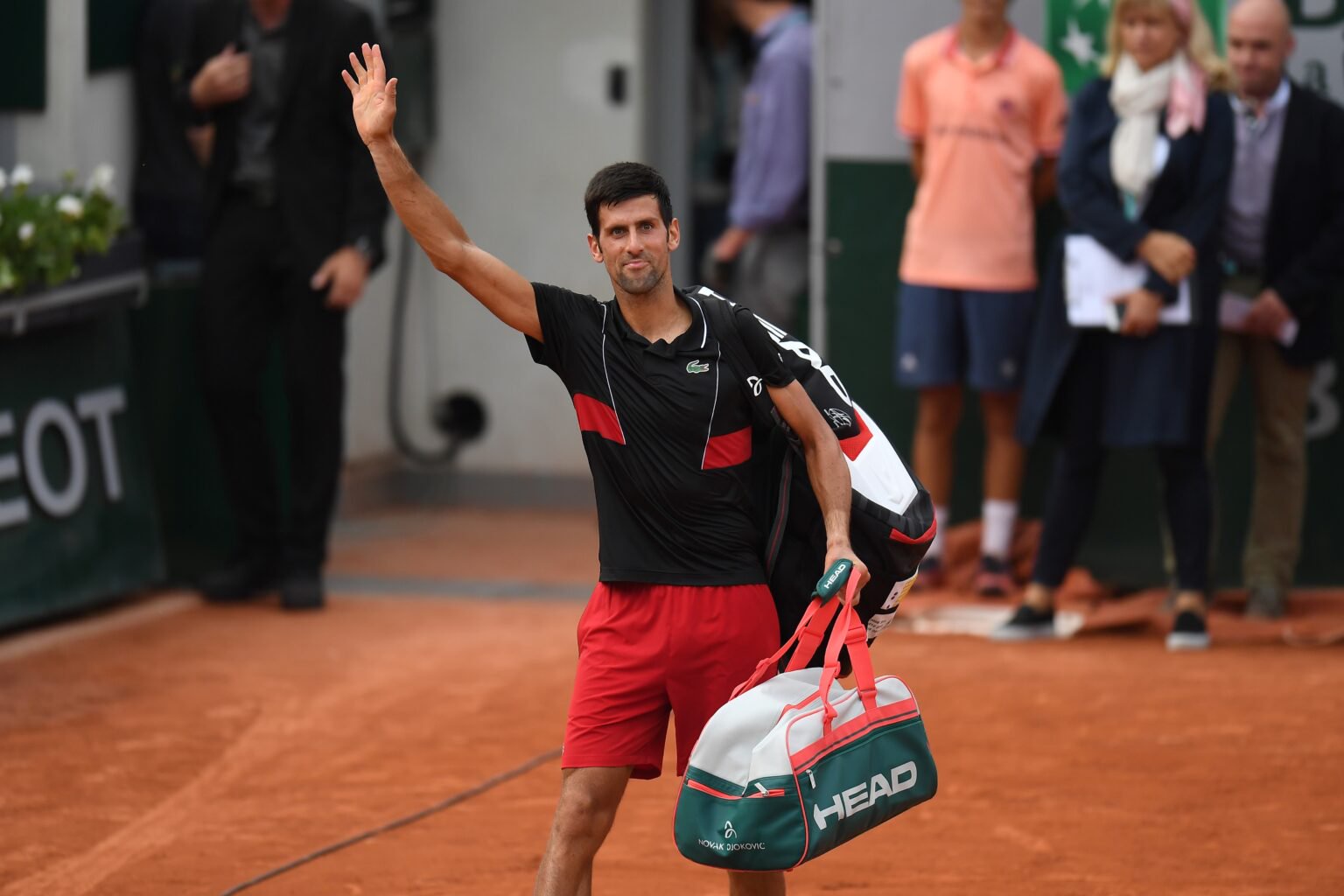 Novak Djokovic waves goodbye after losing French Open quarterfinal to Marco Cecchinato