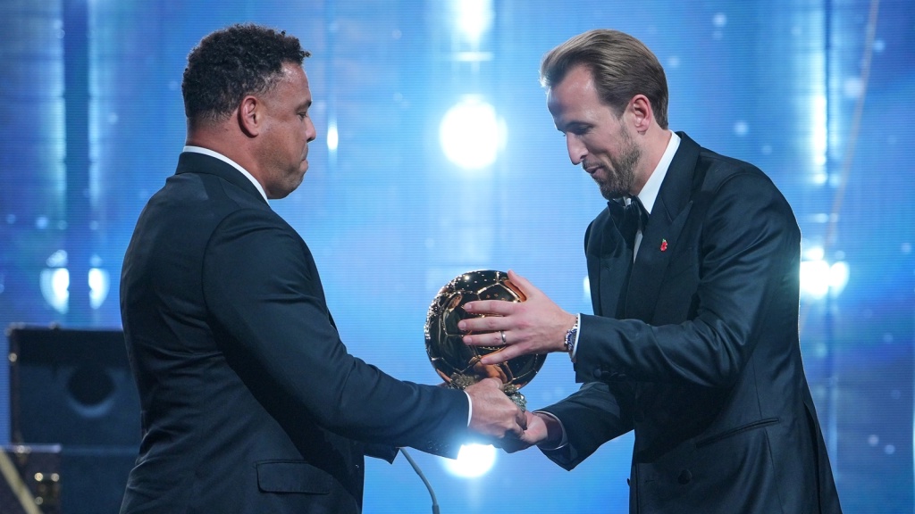 Harry Kane receives the Ballon d'Or from Brazil great Ronaldo. (AP Photo)