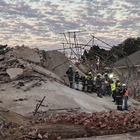 At least 5 dead, dozens missing after a building under construction collapses in South Africa