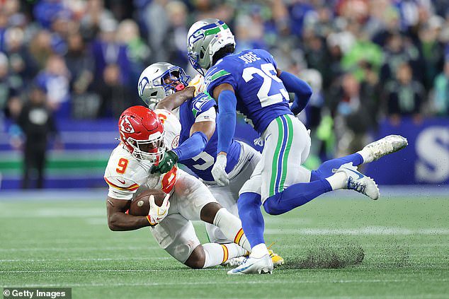 Chiefs running back Kenneth Walker III is tackled by ex-teammate Nick Emmanwori