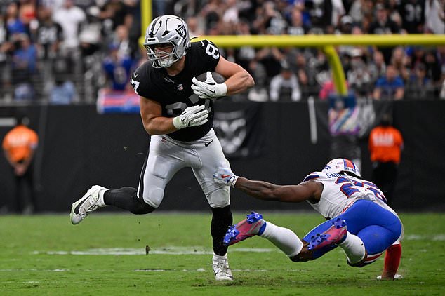 Las Vegas Raiders tight end Michael Mayer (87) makes a catch in front of Buffalo Bills safety C.J. Gardner-Johnson (22) during an NFL football game in Las Vegas, Sunday, Oct. 18, 2026. (AP Photo/David Becker)