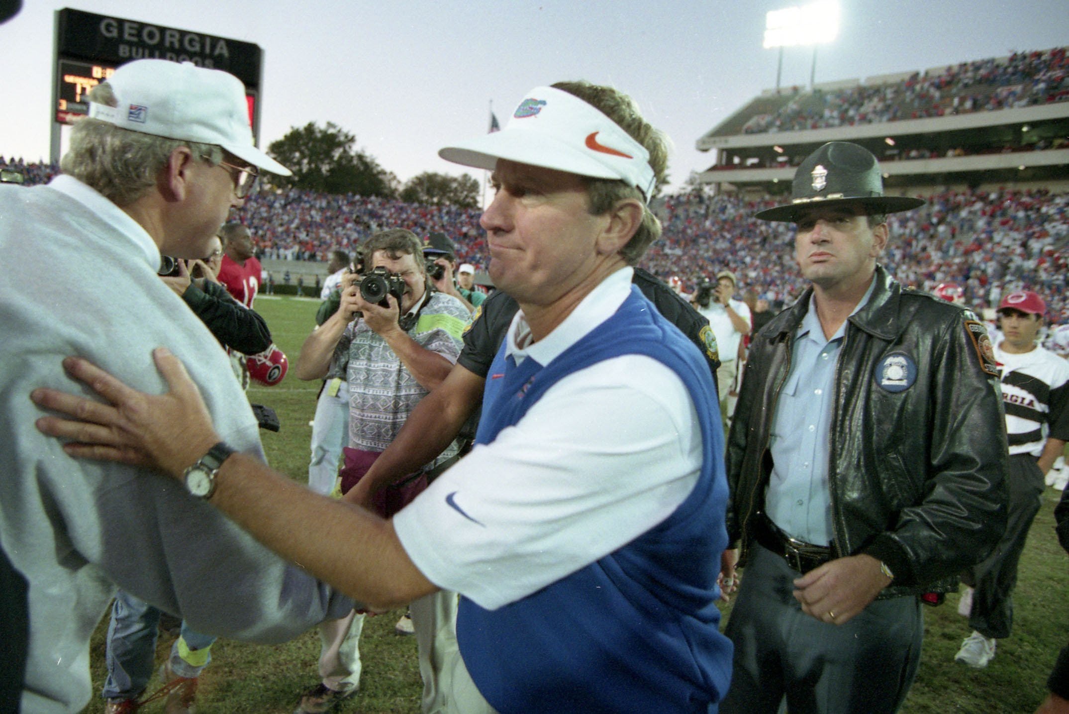 University of Florida football coach Steve Spurrier (right) shakes hands with Georgia coach Ray Goff after the Gators won in Athens on Oct. 28, 1995.