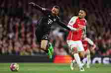 Leroy Sané of Bayern Munich is tackled by William Saliba of Arsenal leading to a penalty decision for Bayern Munich during the UEFA Champions League quarter-final first leg match between Arsenal FC and FC Bayern München at Emirates Stadium on April 09, 2024 in London, England.