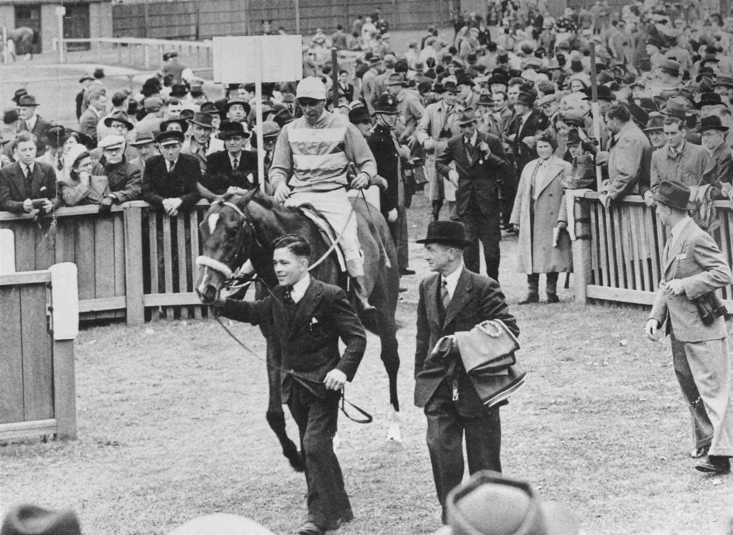 Johnny Tolton leads in Charlie Elliott on Nimbus after their victory in the 2,000 Guineas