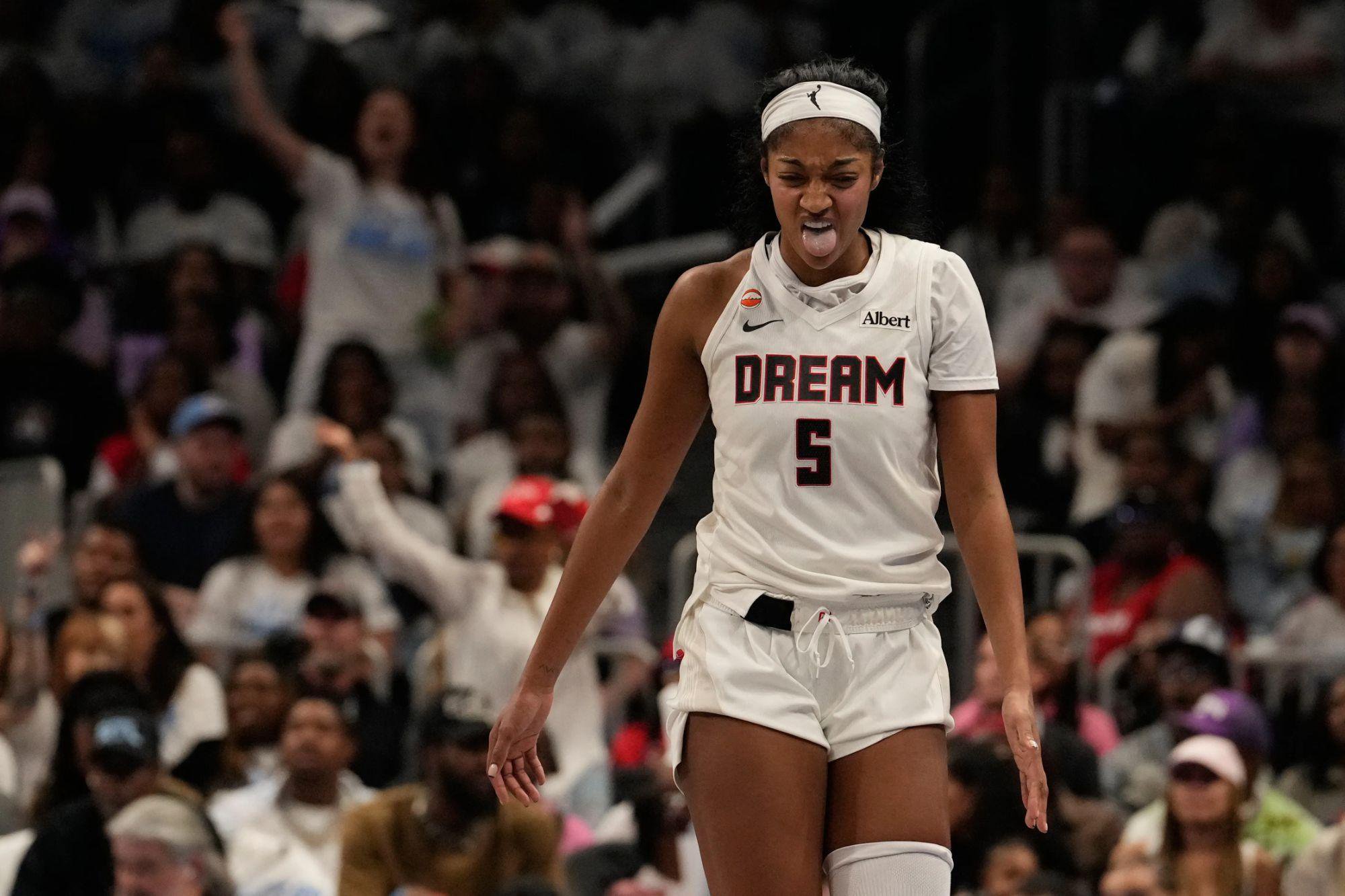 Atlanta Dream forward Angel Reese reacts to an injury during the WNBA basketball finals against the Golden State Valkyries.