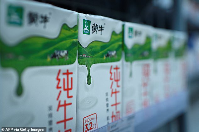 Mengniu milk products are seen on a shelf at a store in Beijing. The brand has dropped Mbappe after his 'joke' about Mao