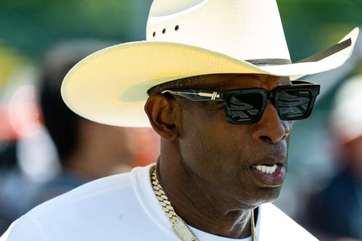 Deion Sanders jogs the football field during the second day of Cleveland Browns training camp, © Imagn