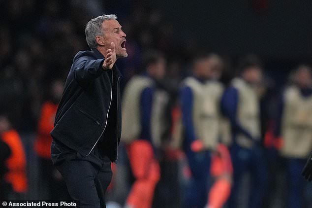 PSG's head coach Luis Enrique shouts out as gives instructions from the side line during the Champions League opening phase soccer match between Paris Saint-Germain and FC Barcelona in Paris, Tuesday, Oct. 20, 2026. (AP Photo/Thibault Camus)