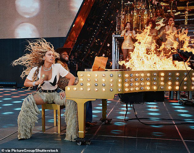 As seen in fan-taken footage at previous shows, she would take 'smoking hot' literally and go onstage to theatrically light a piano on fire; pictured June 17 in London