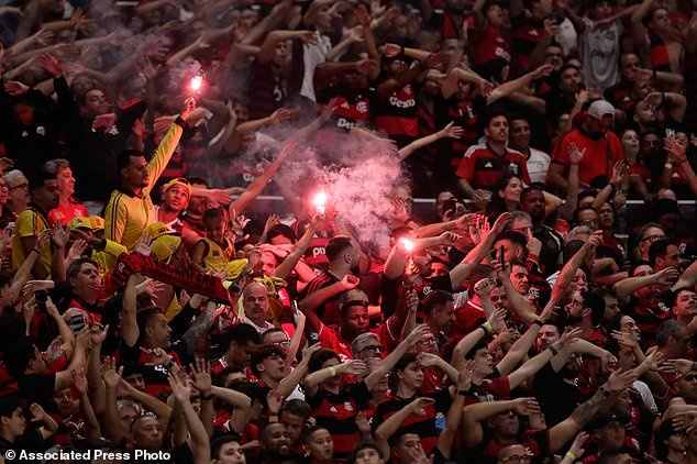 Fans of Brazil's Flamengo cheer prior to the start of the second leg of a Copa Libertadores semifinal soccer match against Argentina's Estudiantes de La Plata in Rio de Janeiro, Thursday, Oct. 22, 2026. (AP Photo/Bruna Prado)