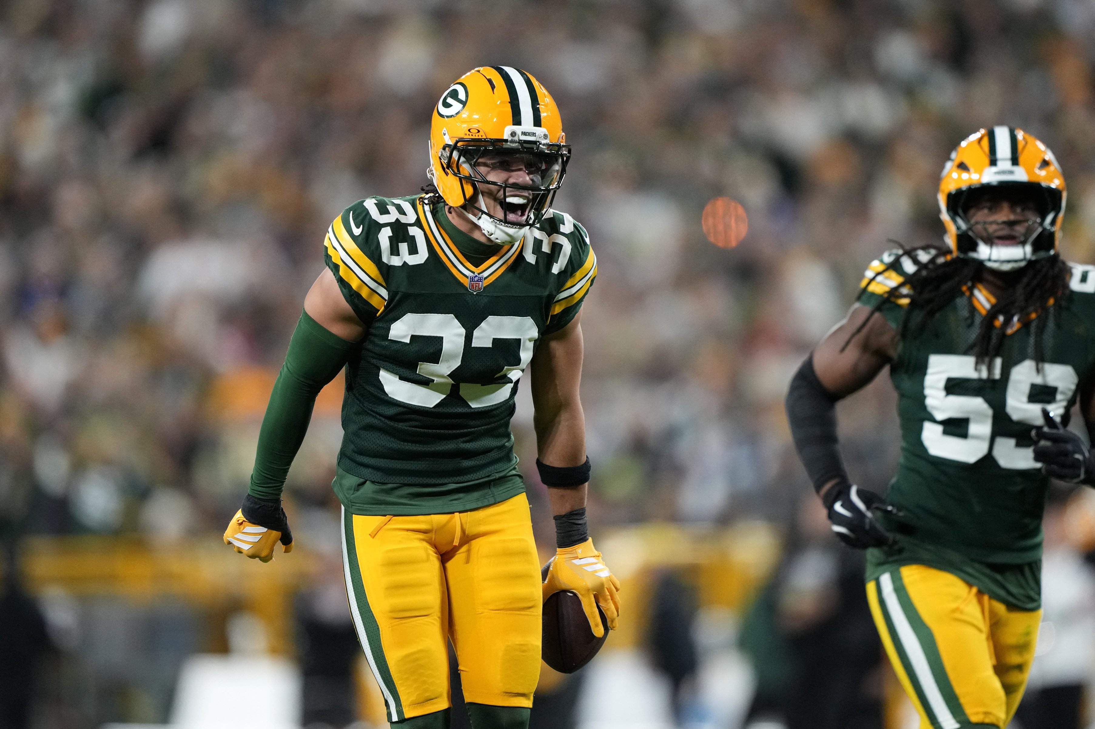 Oct 18, 2026; Green Bay, Wisconsin, USA;  Green Bay Packers safety Evan Williams (33) celebrates after making an interception against the Dallas Cowboys during the second quarter at Lambeau Field.  Mandatory Credit: Jeff Hanisch-Imagn Images