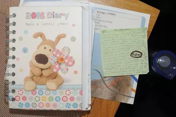 The front of a diary, along with a post-it note which was found inside the diary, recovered from Letby's home