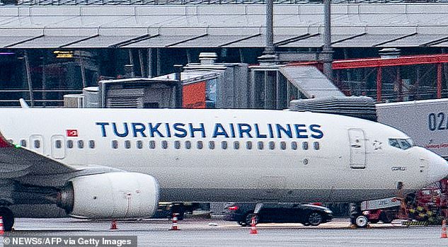 The 35-year-old father is said to have rammed his Audi onto the airport around 8pm local time last night, barricading himself to the foot of a Turkish Airlines plane. Pictured: Negotiations ongoing this morning before his arrest