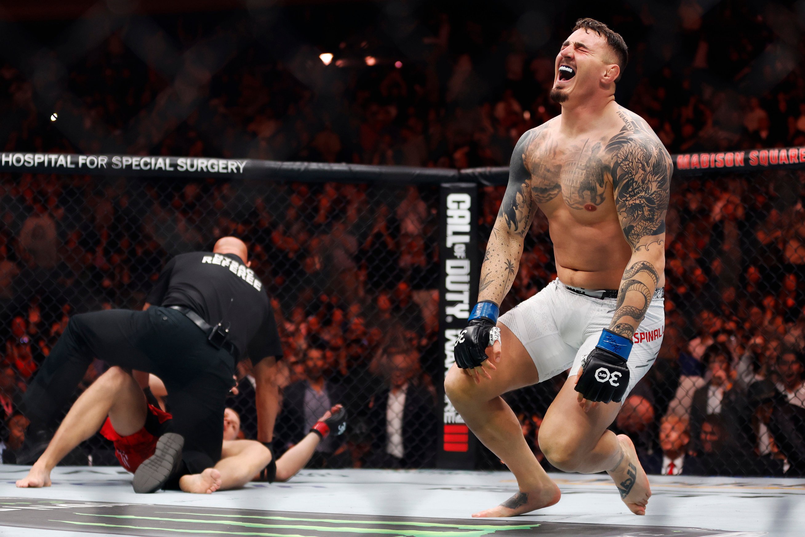 An emotional Tom Aspinall reacts to his interim-title win