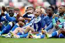 Barry Bannan of Sheffield Wednesday celebrates victory with teammates after avoiding relegation after the Sky Bet Championship match between Sunder...
