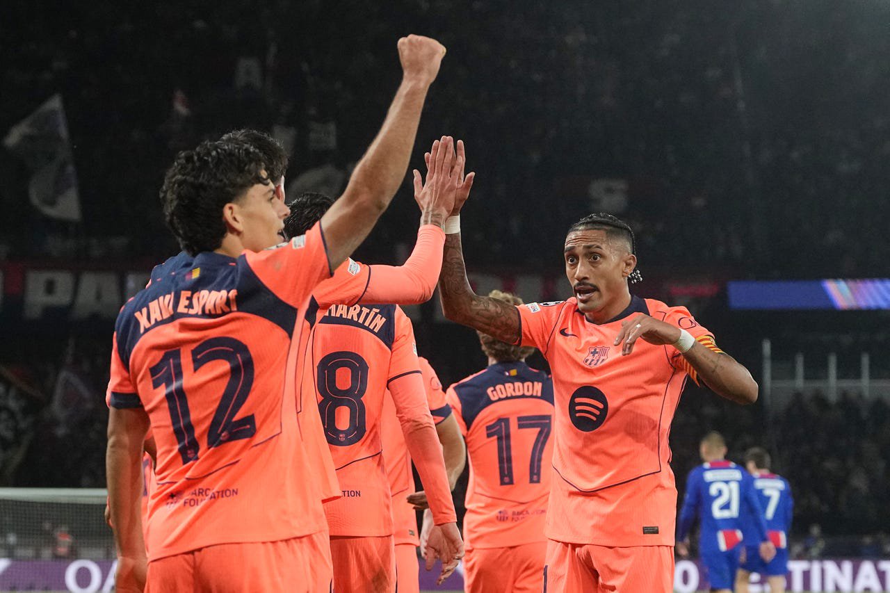 Barcelona’s Xavi Espart, left, celebrates his equaliser