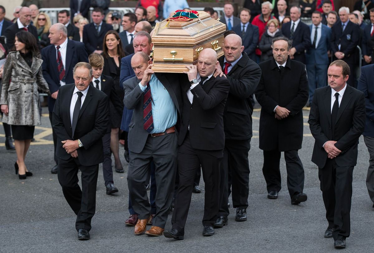 Mick Galwey, Peter Clohessy, Keith Wood and John Hayes carry The coffin of Munster Rugby head coach Anthony Foley 