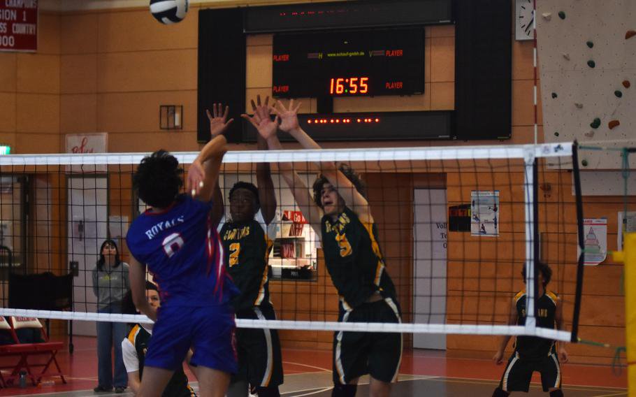 SHAPES’ Liam Hemmes, left,  and Souleymane Dioubate try to block a Ramstein spike at the net in semifinal play. SHAPE advanced to the 2026 DODEA European boys’ Division I volleyball match on Saturday to face Stuttgart.