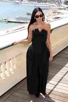 Demi Moore in a black dress and sunglasses at the 77th Annual Cannes Film Festival photocall