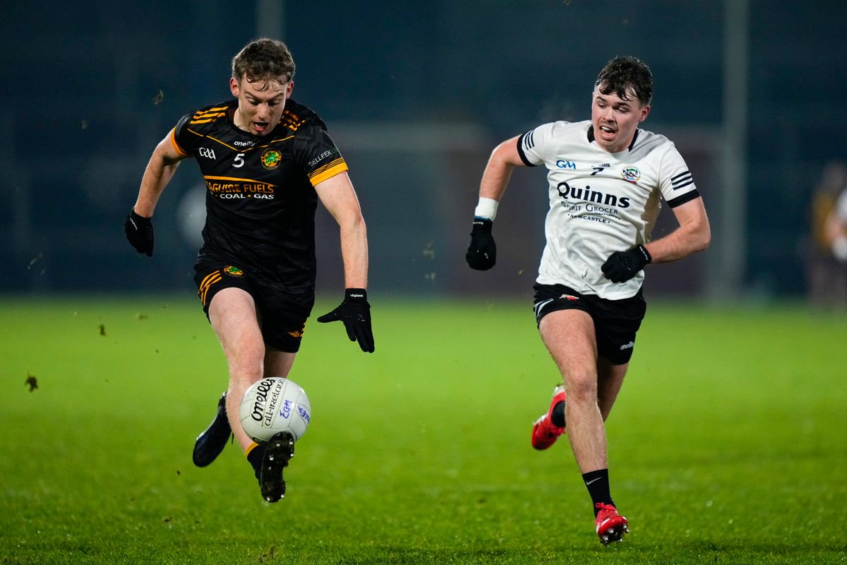 Oisin Kelm of Erne Gaels Belleek in action against Callum Rogers of Kilcoo in 2025.